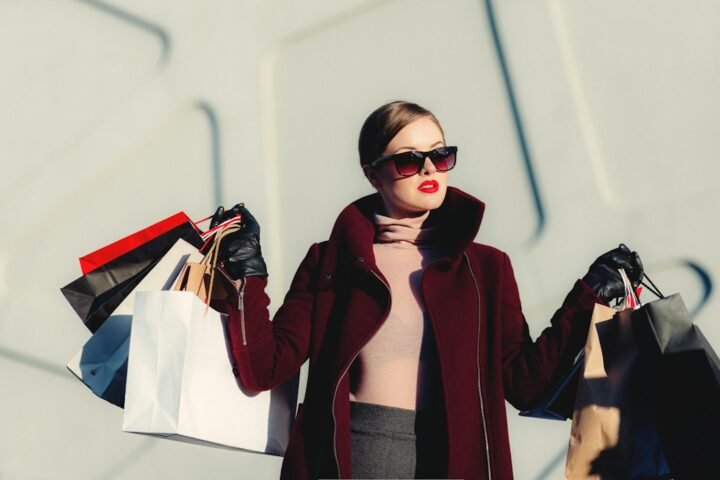 Shoppers browsing clothing representing consumer spending behavior