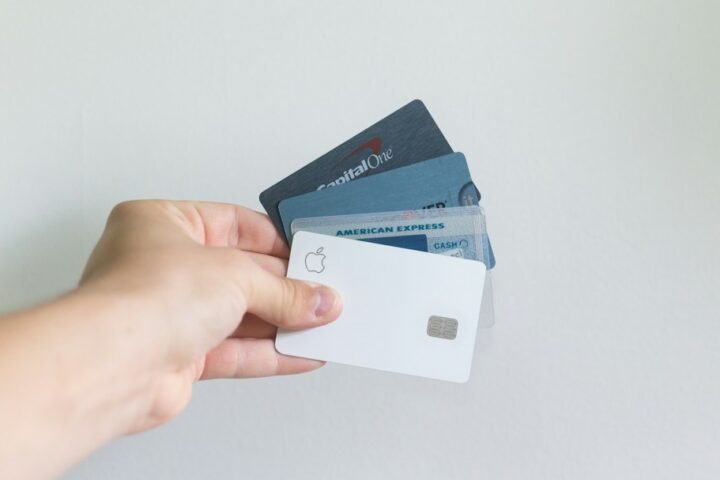 Person holding credit cards for an article about minimum payments