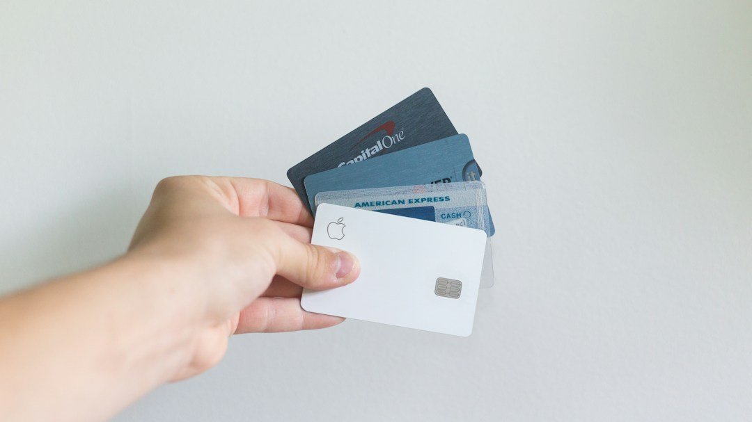 Person holding credit cards for an article about minimum payments