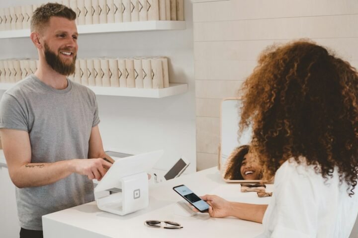 Customer making a card payment at a checkout terminal